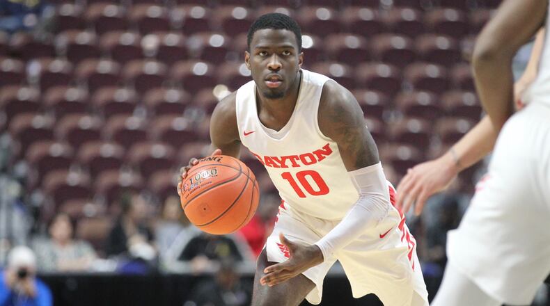 Dayton’s Jalen Crutcher runs the offense against Tulsa on Sunday, Dec. 16, 2018, at Mohegan Sun Arena in Uncasville, Conn. David Jablonski/Staff