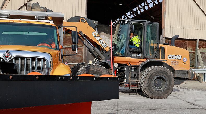 City of Springfield service department employees fill a salt truck Wednesday, Dec. 21, 2022, as they prepare for the winter storm predicted to disrupt holiday week travel. BILL LACKEY/STAFF