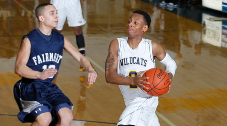 Kamarta' Curry (2) of Springfield is guarded by Chris Beatty (12) of Fairmont during Friday's basketball game at Springfield High School on Feb. 15, 2013. Barbara J. Perenic/Staff