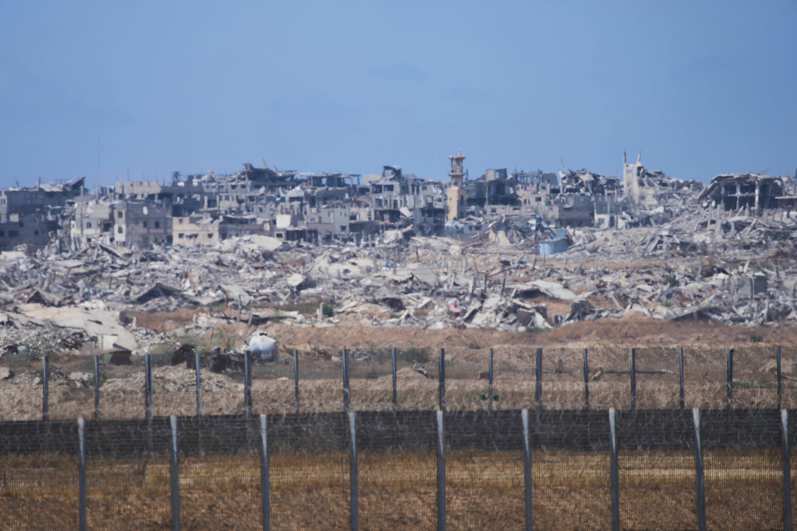Destroyed buildings in the Gaza Strip, seen from southern Israel, Sunday, May 4, 2025. (AP Photo/Ariel Schalit)