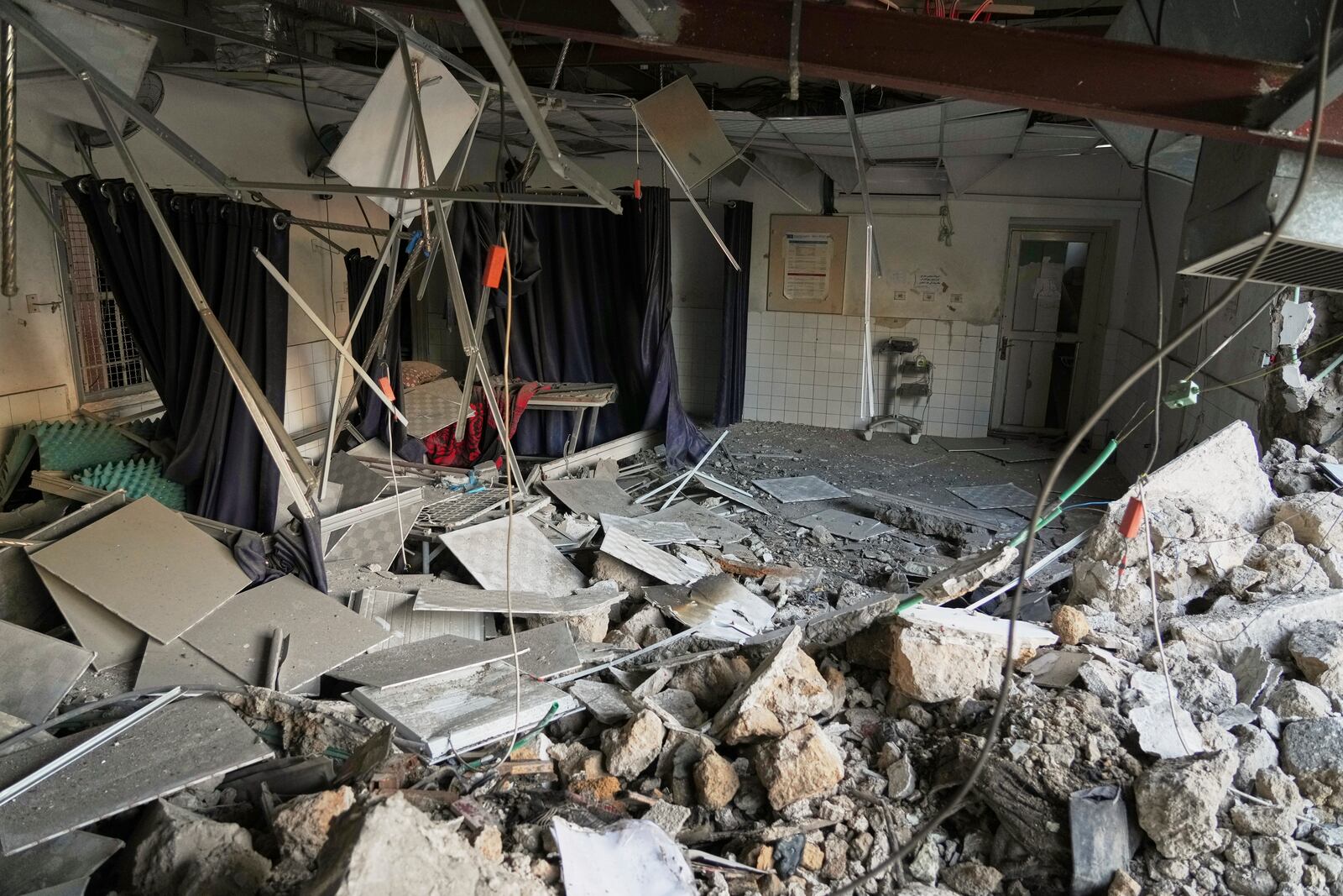 The outpatient and laboratory wards of the Al-Ahli Arab Baptist hospital are seen after being hit by an Israeli army strike late Saturday, following a warning issued by the army to evacuate patients, in Gaza City, Sunday, April 13, 2025. (AP Photo/Jehad Alshrafi)