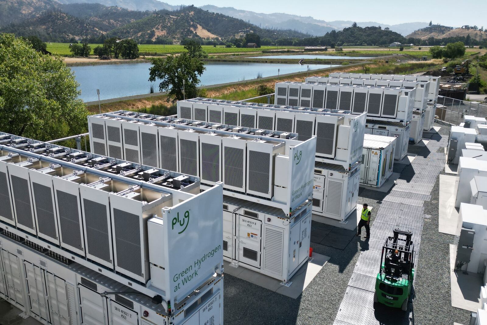 A worker walks through Energy Vault's facility, a company that is creating an emergency power system that relies on hydrogen and battery storage, on Tuesday, May 27, 2025, in Calistoga, Calif. (AP Photo/Terry Chea)