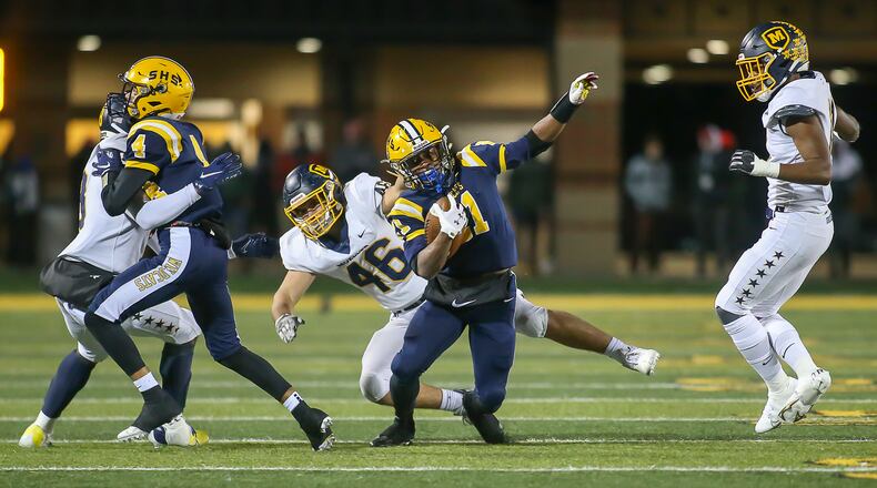 Springfield's Jayvin Norman runs against Moeller in the Division I state semifinals at Sidney High School on Friday, Nov. 26, 2021. Michael Cooper/CONTRIBUTED