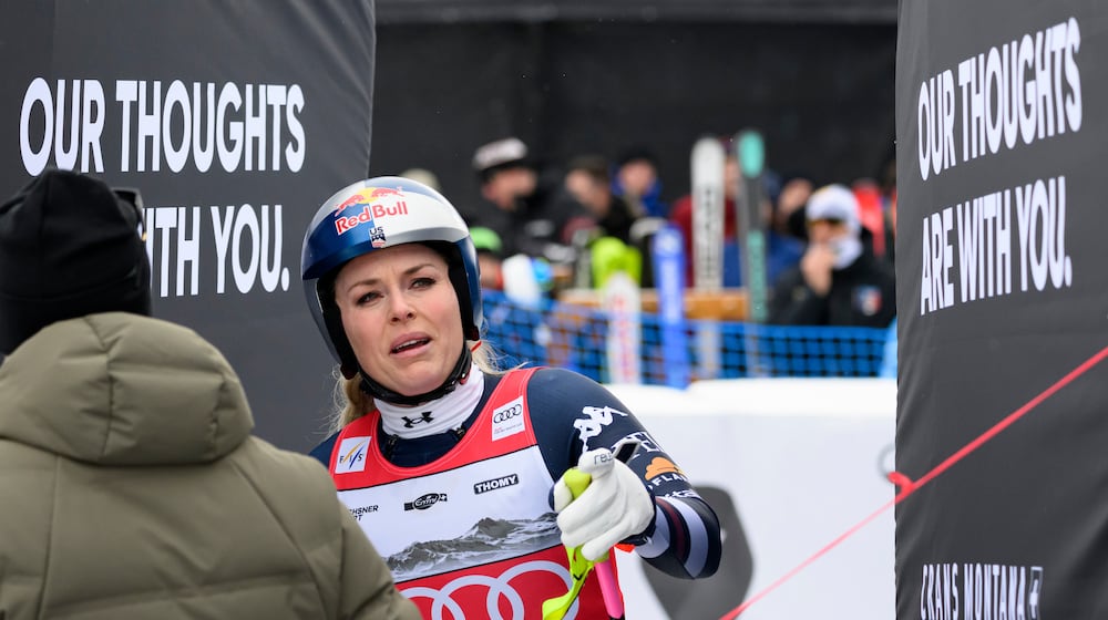 United States' Lindsey Vonn at the finish area after crashing, during an alpine ski, women’s World Cup downhill, in Crans Montana, Switzerland, Friday, Jan. 30, 2026. (Alessandro Della Valle/Keystone via AP)