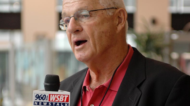 FILE - Paul Wiggin, defensive tackle for Stanford 1954-56, talks to a local radio station at a reception for players being enshrined into the College Football Hall of Fame, Aug. 10, 2006, in South Bend, Ind. (AP Photo/Joe Raymond, File)