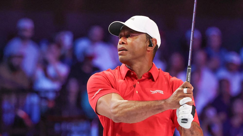 Tiger Woods of the Jupiter Links Golf Club plays his shot from the second tee the TGL finals golf tournament in Palm Beach Gardens, Fla., Tuesday, March 24, 2026. (AP Photo/Reinhold Matay)