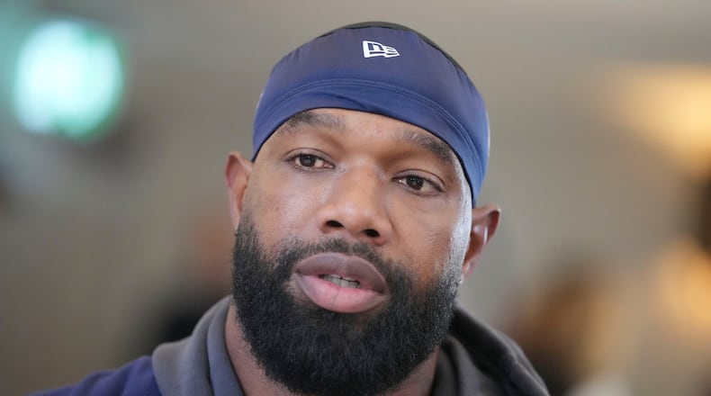 FILE - Chicago Bears tight end Marcedes Lewis (84), who recently signed with the Broncos, speaks during an interview after a NFL football training session in Ware, England, Oct. 11, 2024. (AP Photo/Kin Cheung, File)