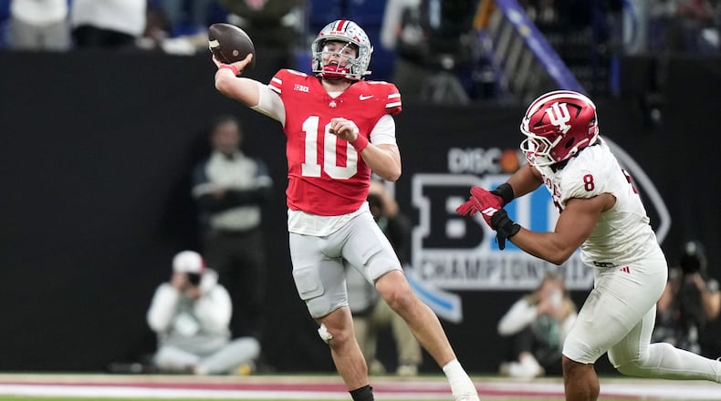 Ohio State's Julian Sayin throws against Indiana's Stephen Daley during the second half of the Big Ten championship NCAA college football game in Indianapolis, Saturday, Dec. 6, 2025. (AP Photo/AJ Mast)
