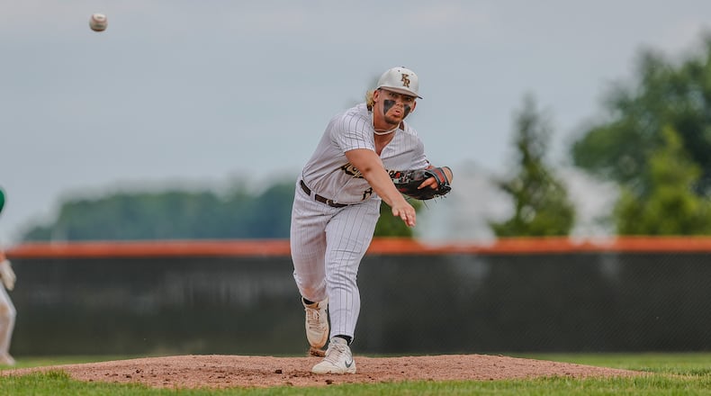 Cutline: Kenton Ridge High School junior Jake Beard delivers a pitch during their Division II district final game against Chaminade Julienne on Thursday night at Arcanum High School. Beard threw a one-hitter as the Cougars won 3-0. Michael Cooper/CONTRIBUTED