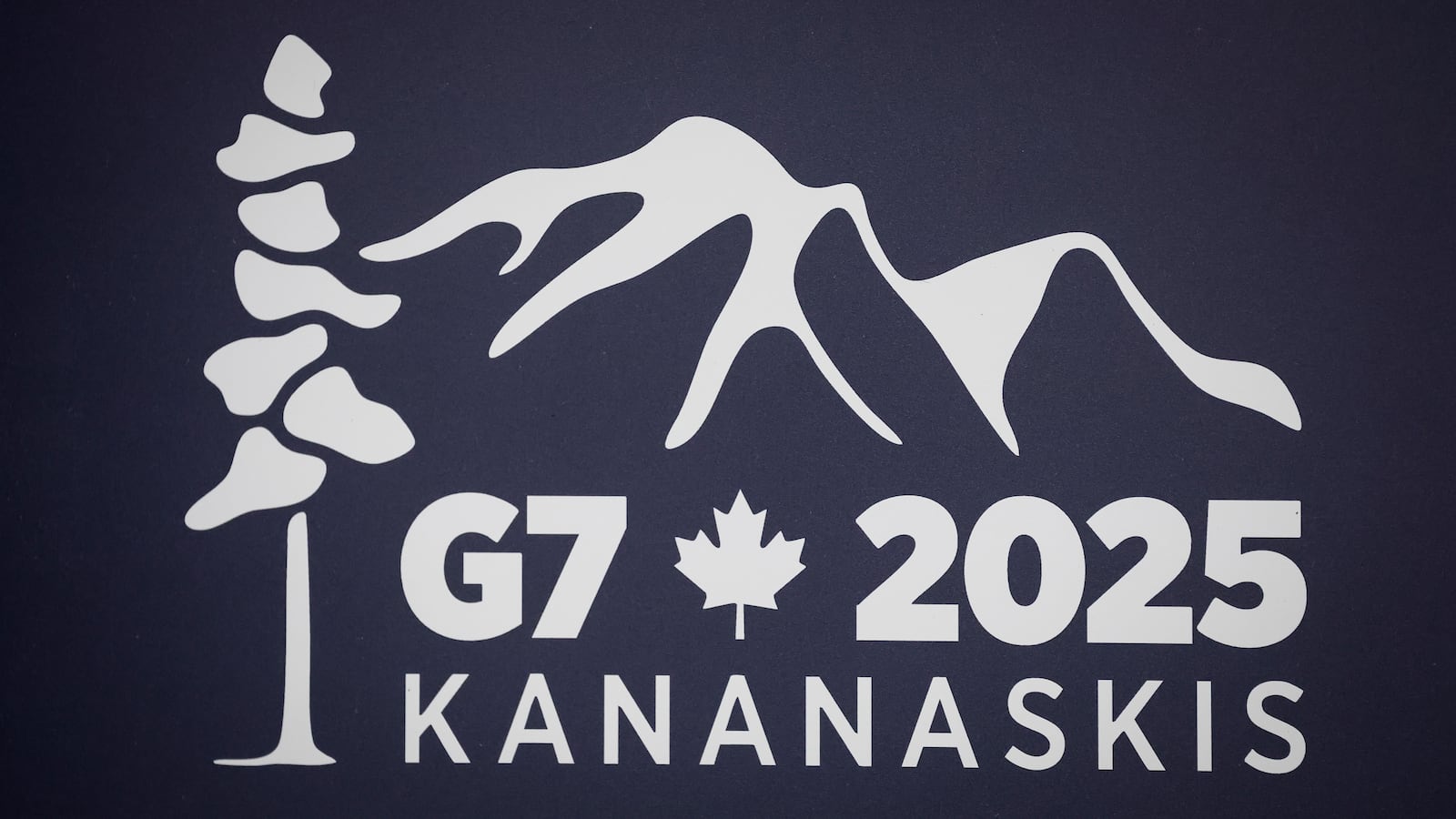 A logo for the G7 2025 Kananaskis meeting is pictured at a news conference in Banff, Alberta, Canada, Thursday, May 22, 2025. (Jeff McIntosh/The Canadian Press via AP)