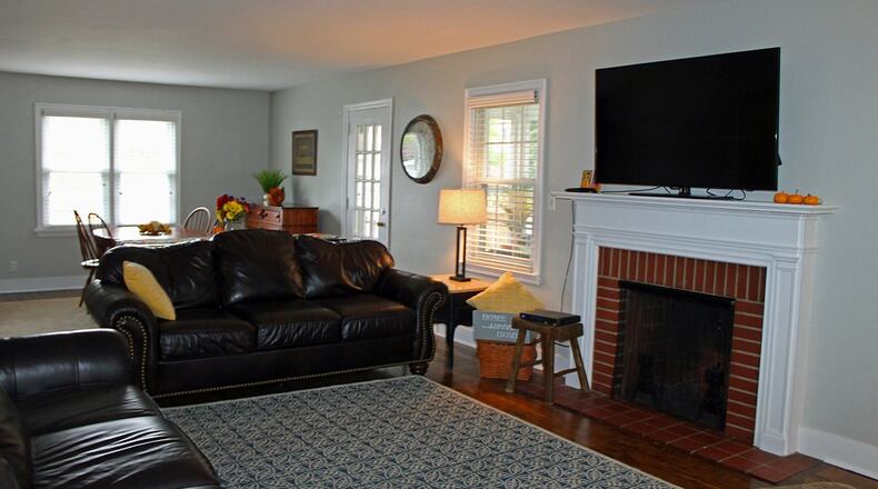 A decorative fireplace serves as a welcoming focal point in the living room.