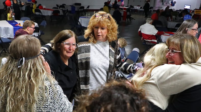Clark County Sheriff Deborah Burchett, at left, celebrates with her friends and supporters after Burchett's re-election was announced Tuesday eventing at a watch party. BILL LACKEY/STAFF