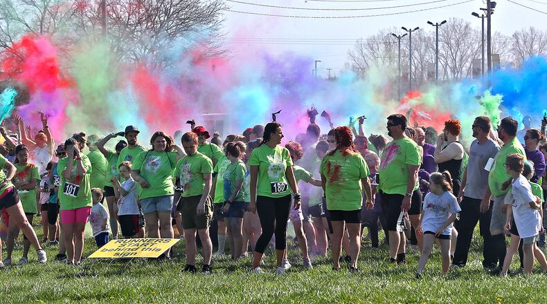 Clark County's most colorful benefit, the Dye Hard 5K Race/Walk was held Sunday, April 24, 2022 at the Clark County Fairgrounds. Hundreds of people participated in the annual event that benefits people with developmental desabilties. As runners and walkers made their way around the course colorful powder was thrown on them at different stations. BILL LACKEY/STAFF