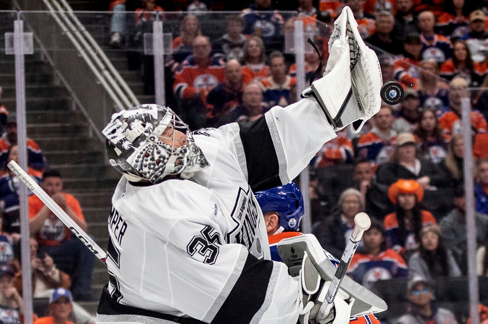 Los Angeles Kings' goalie Darcy Kuemper (35) makes a save against the Edmonton Oilers during the second period of an NHL playoff game in Edmonton on Sunday, April 27, 2025. (Jason Franson/The Canadian Press via AP)