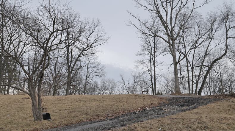 A lot along Ridge Road where a house once stood before the tornado destroyed it a year ago. BILL LACKEY/STAFF