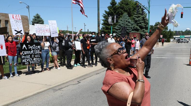 Denise Williams, president of the Springfield NAACP, leads the protesters in a chant during a demonstration last summer against racial injustice in the country. BILL LACKEY/STAFF