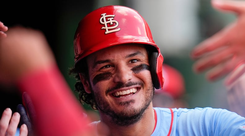FILE - St. Louis Cardinals' Nolan Arenado celebrates in the dugout after hitting a home run during the fourth inning of a baseball game against the Chicago Cubs, Saturday, Sept. 27, 2025, in Chicago. (AP Photo/Erin Hooley, File)