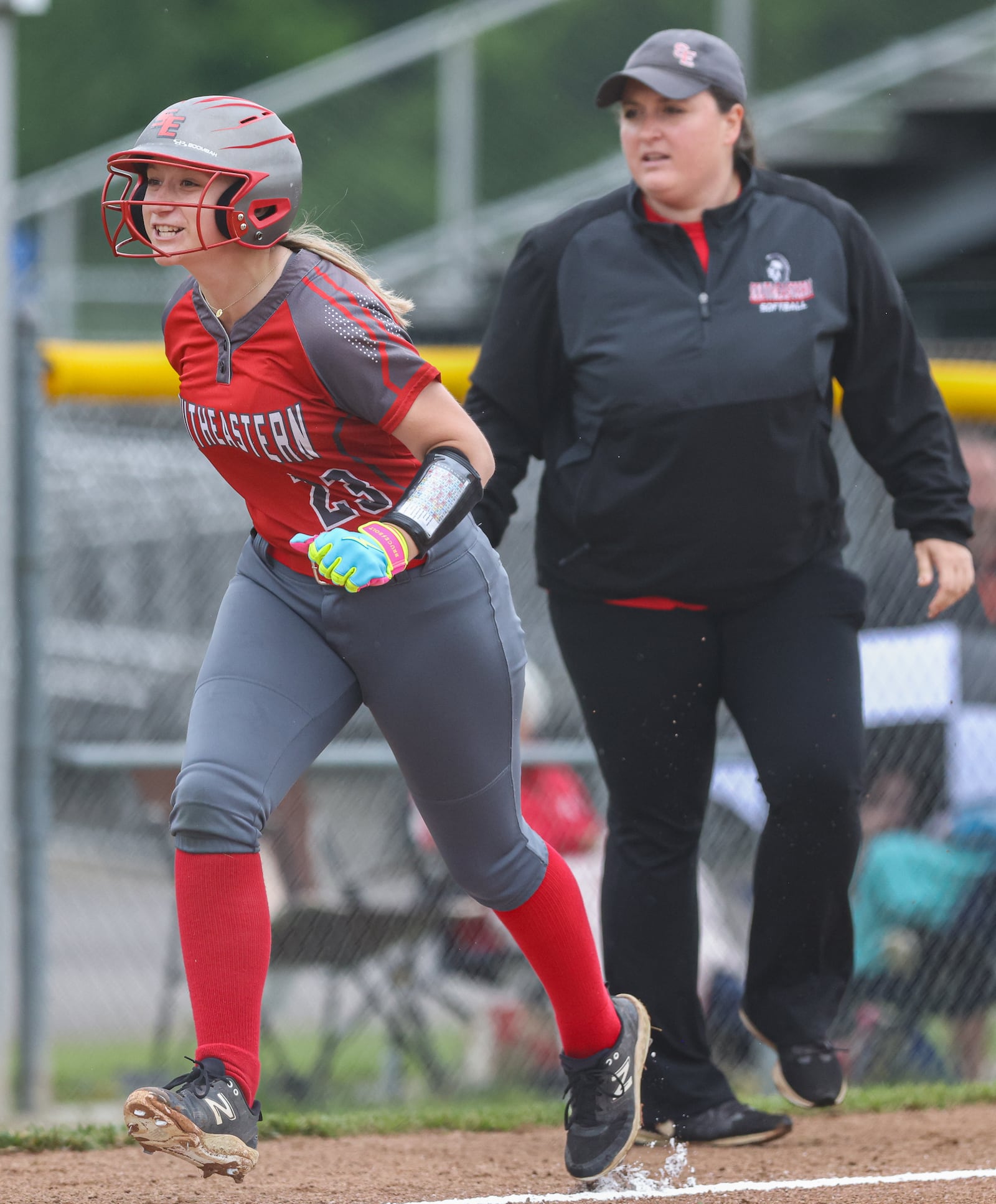 Southeastern junior pitcher Reese Wells celebrates while rounding third after hitting a home run during a Division VII regional semifinal against Waynesfield-Goshen on Wednesday at Northmont High School. BRYANT BILLING / STAFF