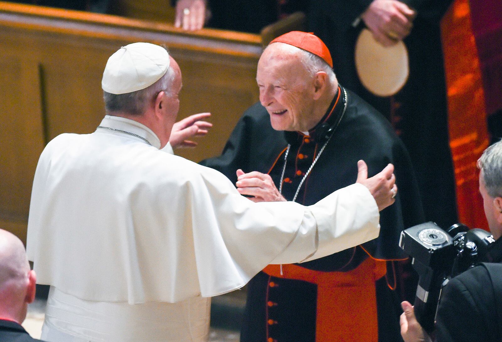 FILE - In this Sept. 23, 2015 file photo, Pope Francis reaches out to hug Cardinal Archbishop emeritus Theodore McCarrick after the Midday Prayer of the Divine with more than 300 U.S. Bishops at the Cathedral of St. Matthew the Apostle in Washington. (Jonathan Newton / The Washington Post via AP, Pool, File)