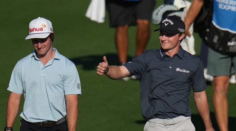Blades Brown, right, reacts for a cheering gallery as he walks with David Ford as the gallery cheers for Brown who finished with a 12-under-par 60 during the second round of the American Express golf event at the Jack Nicklaus Tournament Course at PGA West Friday, Jan. 23, 2026, in La Quinta, Calif. (AP Photo/Ross D. Franklin)