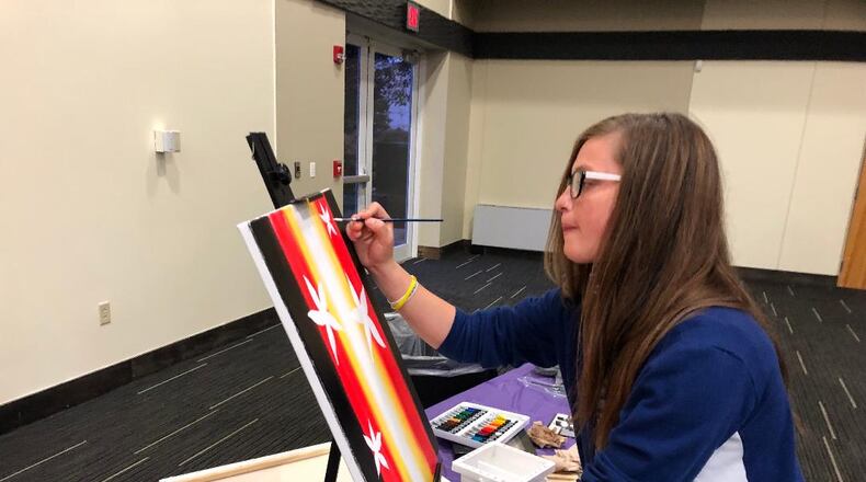 Tory Campbell painted live at the 2021 A Night of Hope" event. She uses art as part of her therapy in overcoming substance addiction. Photo by Brett Turner