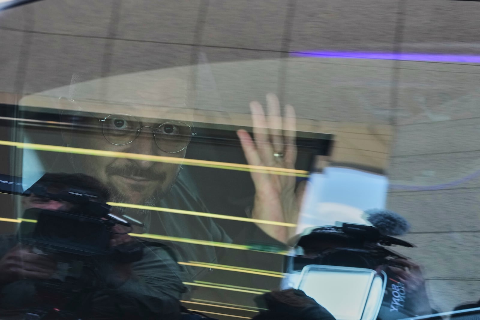 Ukrainian President Volodymyr Zelenskyy gestures to journalists as he leaves upon his arrival at Esenboga airport in Ankara, Turkey, Thursday, May 15, 2025. (AP Photo/Evgeniy Maloletka)