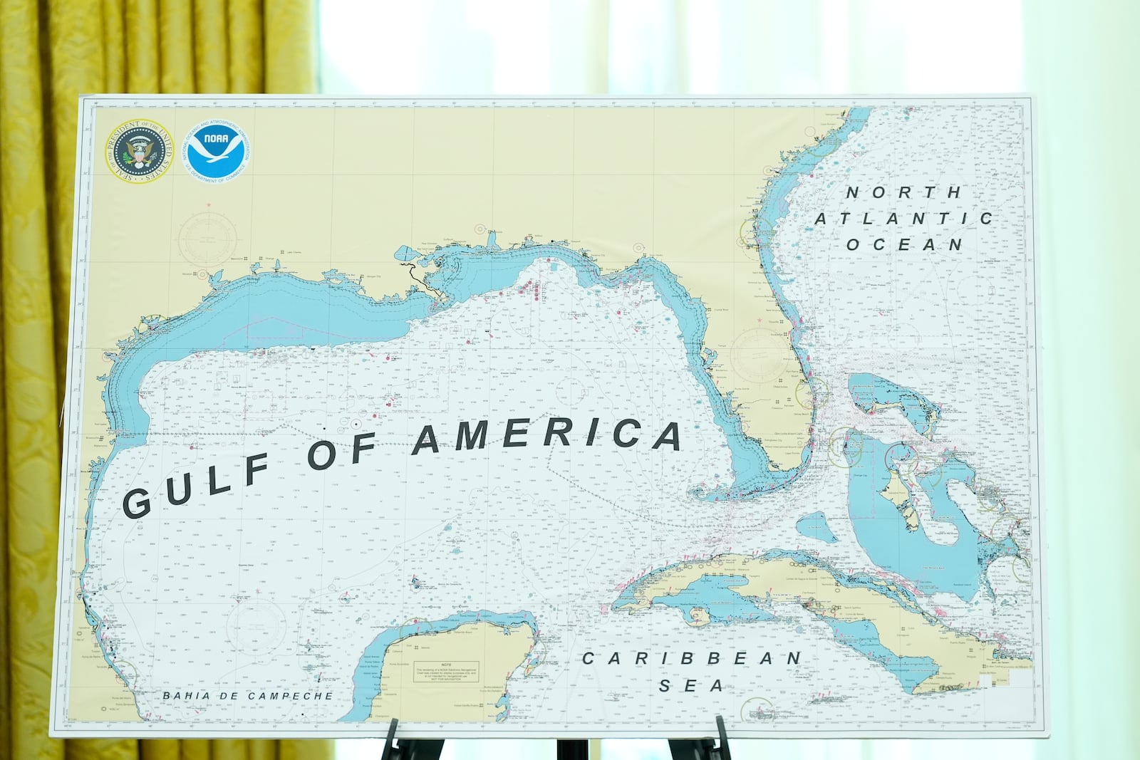 A map with Gulf of America written on it is pictured during a swearing in ceremony for Dr. Mehmet Oz to be Administrator of the Centers for Medicare and Medicaid Services, in the Oval Office of the White House, Friday, April 18, 2025, in Washington. (AP Photo/Alex Brandon)