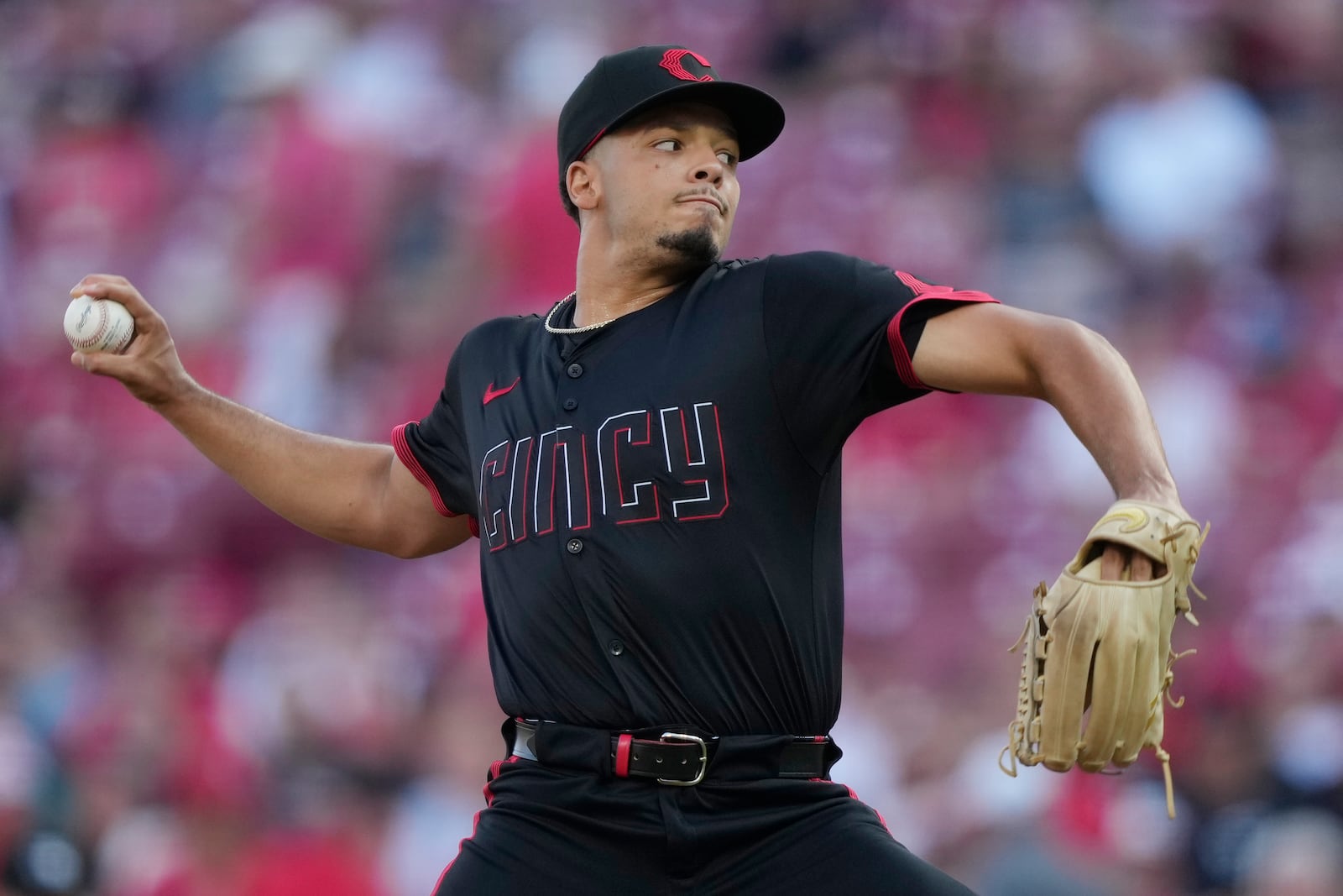 Cincinnati Reds pitcher Chase Burns throws during the first inning of a baseball game against the Colorado Rockies in Cincinnati, Friday, July 11, 2025. (AP Photo/Carolyn Kaster)