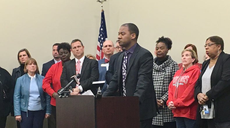 Middletown Schools Superintendent Marlon Styles Jr. — flanked by dozens of area public school superintendents, school board members and public school advocates — spoke out Thursday against the recent expansion of Ohio’s EdChoice private school voucher program. The changes will cost public school districts forced to pay a major portion of the private school tuition costs of resident children millions of dollars of local taxpayer monies. MICHAEL D. CLARK/STAFF