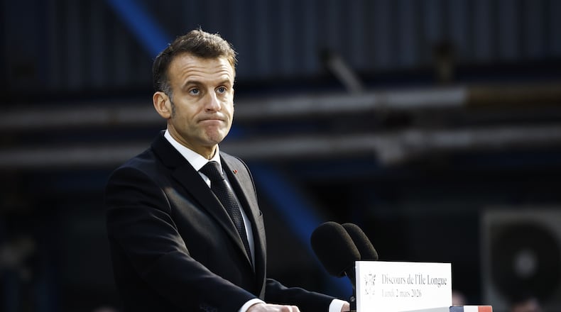 French President Emmanuel Macron delivers a speech next to the submarine 'Le Temeraire' (The Temerarious) at the Nuclear submarines Navy base of Ile Longue in Crozon, France, Monday March 2, 2026. (Yoan Valat/Pool Photo via AP)