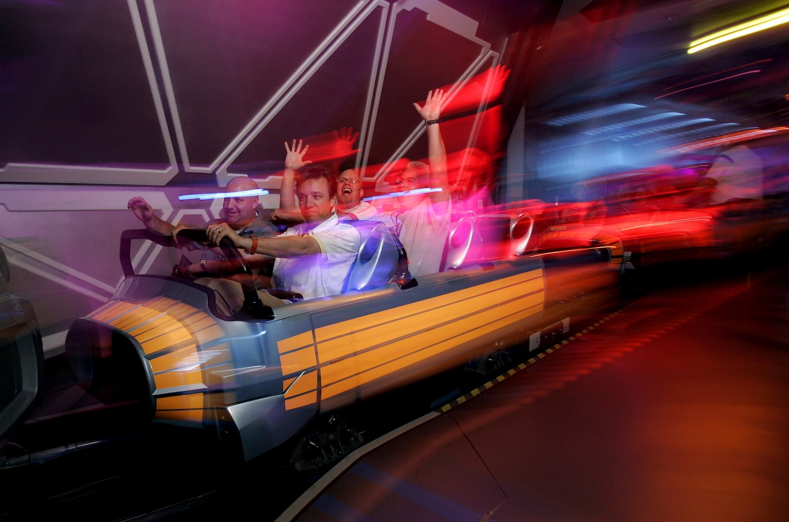 FILE - Guests ride Disneyland's "Space Mountain" attraction in Anaheim, Calif., July 15, 2005. (AP Photo/Kevork Djansezian, File)