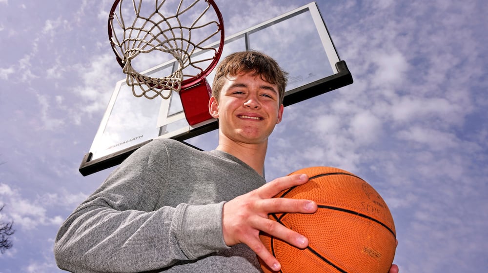 Otto Schellhamer, an eighth-grader who has the only perfect bracket after the opening weekend of the men’s and women’s NCAA college basketball tournaments, poses in his backyard in Plum Borough, Pa., Wednesday, March 25, 2026. (AP Photo/Gene J. Puskar)