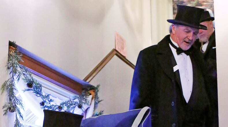 Groundhog Club handlers John Griffiths, top right and Ron Ploucha, left, carry Punxsutawney Phil, the weather prognosticating groundhog, down a flight of stairs after attending a function on Groundhog Day eve in Punxsutawney, Pa. Wednesday, Feb. 1, 2017. The members of the Punxsutawney Groundhog Club's inner circle with make their trek to Gobber's Knob for the 131st time early Thursday morning. (AP Photo/Gene J. Puskar)