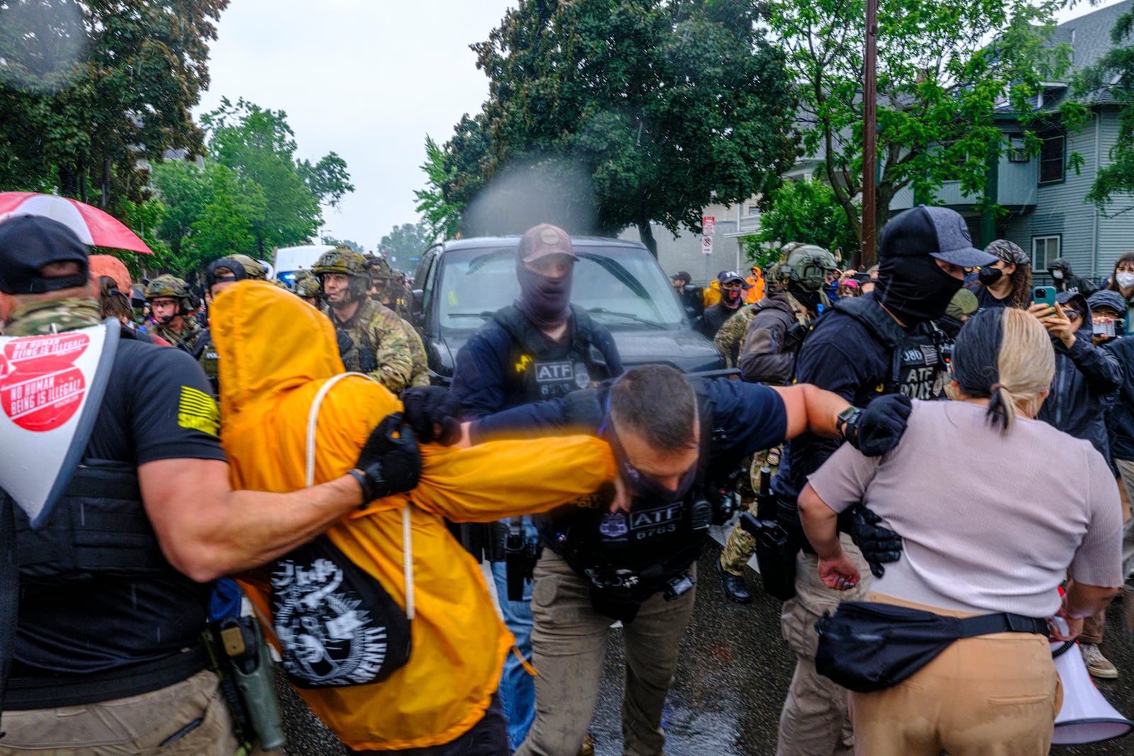 Protesters confront ICE, ATF, and FBI officers as federal agents conduct an operation in Minneapolis, on Tuesday, June 3, 2025. (Kerem Yücel/Minnesota Public Radio via AP)