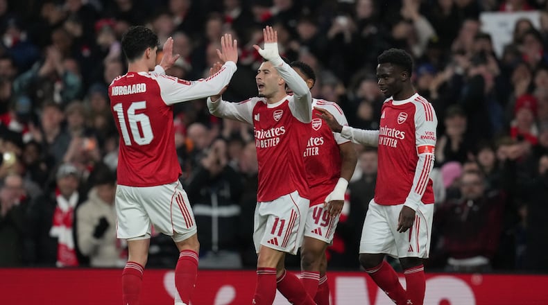Arsenal's Gabriel Martinelli, center, celebrates with teammates after scoring their side's second goal during the English FA Cup soccer match between Arsenal and Wigan Athletic in London, Sunday, Feb. 15, 2026.(AP Photo/Maja Smiejkowska)