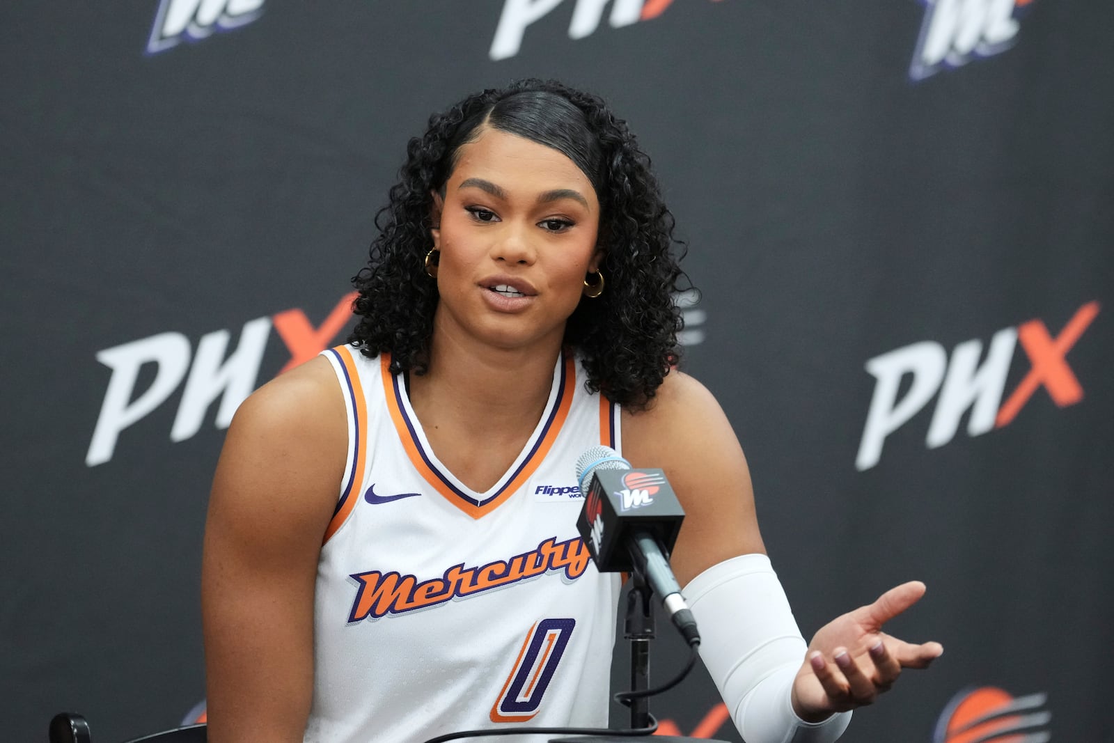 Phoenix Mercury forward Satou Sabally answers a quesion during Mercury Media Day at the team's WNBA basketball training facility Wednesday, April 30, 2025, in Phoenix. (AP Photo/Ross D. Franklin)