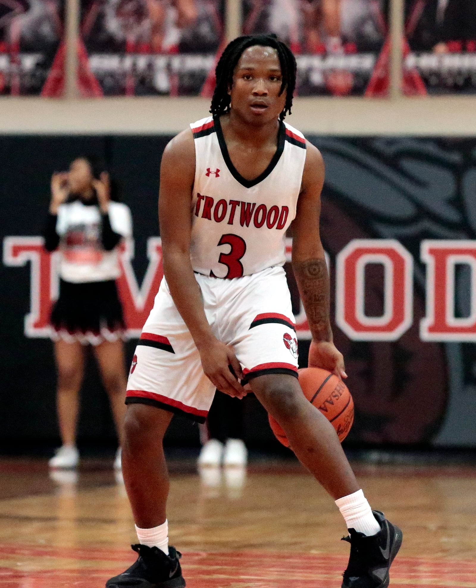 Trotwood senior Caron Foster dribbles between his legs as he starts the offense. Trotwood defeated Oakwood 71-44 on Tuesday, Feb. 17, 2026, in Trotwood. STEVEN WRIGHT / STAFF
