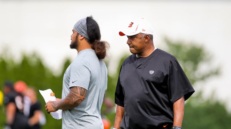 Cincinnati Bengals linebacker Rey Maualuga (left) stands next to head coach Marvin Lewis during a pre-season practice held in downtown Cincinnati Monday, Aug. 13, 2012. Staff photo by Nick Daggy