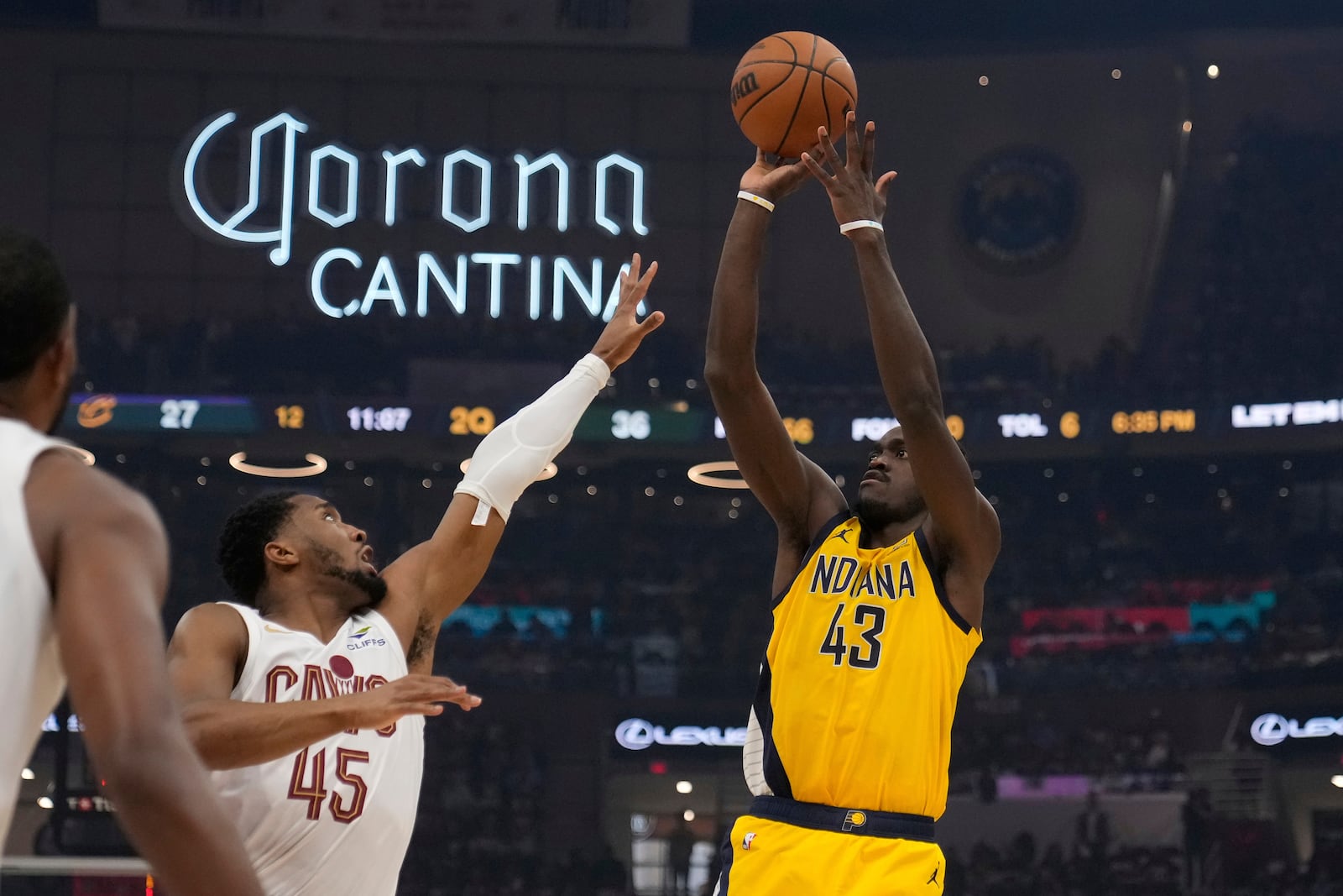 Indiana Pacers forward Pascal Siakam (43) shoots over Cleveland Cavaliers' Donovan Mitchell (45) in the first half during Game 1 in the Eastern Conference semifinals of the NBA basketball playoffs Sunday, May 4, 2025, in Cleveland. (AP Photo/Sue Ogrocki)