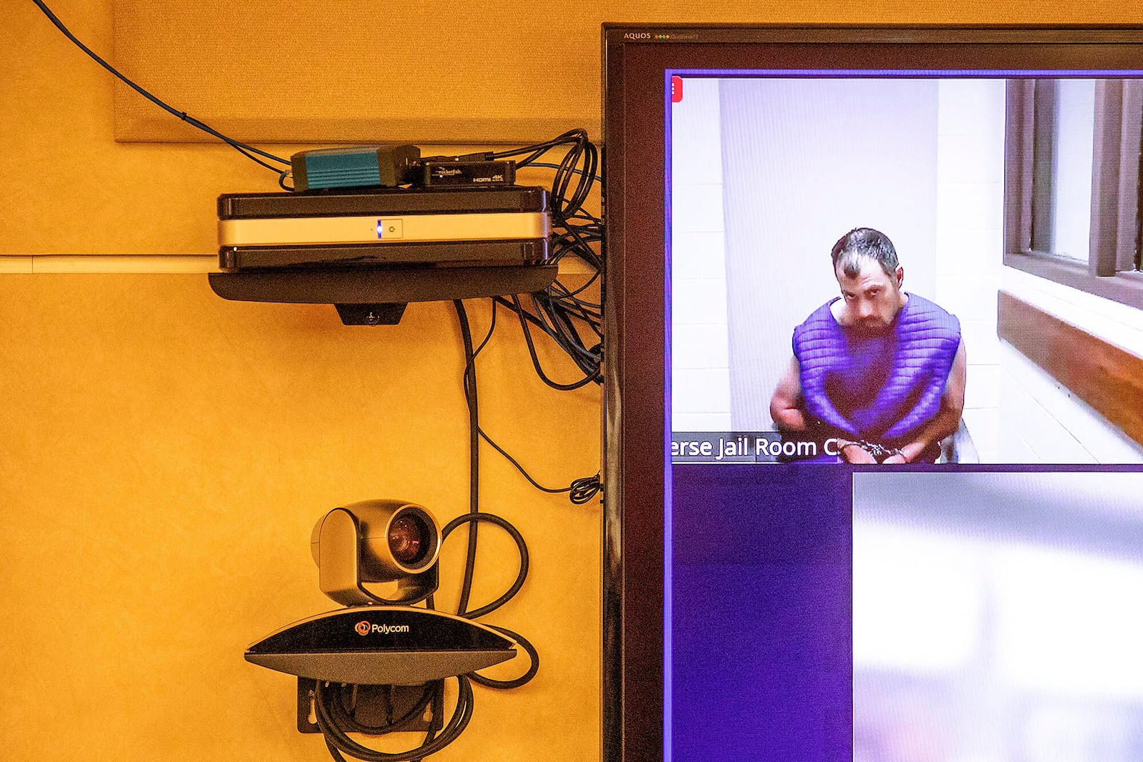 Bradford James Gille appears remotely in front of Chief Magistrate Tammi Rodgers, Monday, July 28, 2025, in Traverse City, Mich., on terrorism and assault with intent to murder charges in connection with stabbing attacks on Saturday at Walmart. (Jan-Michael Stump/Traverse City Record-Eagle via AP)