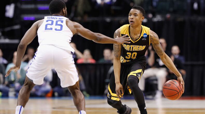 INDIANAPOLIS, IN - MARCH 17: Lavone Holland II #30 of the Northern Kentucky Norse dribbles against Dominique Hawkins #25 of the Kentucky Wildcats in the second half during the first round of the 2017 NCAA Men’s Basketball Tournament at Bankers Life Fieldhouse on March 17, 2017 in Indianapolis, Indiana. (Photo by Joe Robbins/Getty Images)