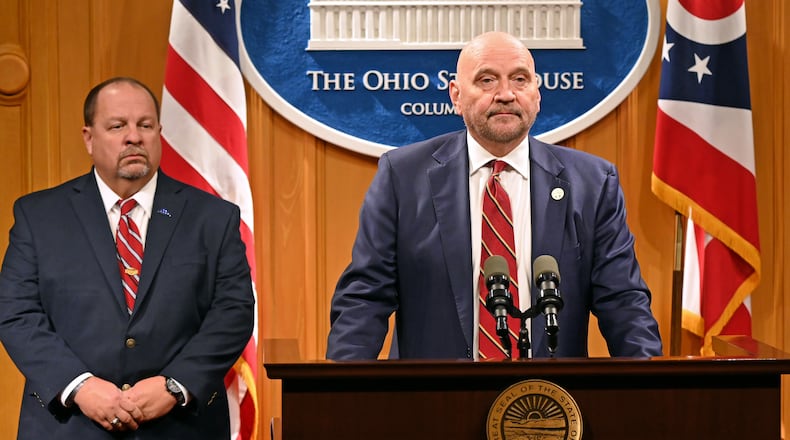 State Rep. Tom Young, R-Washington Twp., (right) discusses establishing a penalty for the mutilation of a deceased animal as part of legislation outlined at a press conference at the Ohio Statehouse in Columbus Wednesday, Nov. 15, 2023. Young was joined Sgt. Jeff Muncy of the Miamisburg Police Department (left), who thanked Young for putting the bill together after a Miamisburg student couldn't be charged for stabbing the corpse of a dog that was struck and killed by a vehicle. CONTRIBUTED