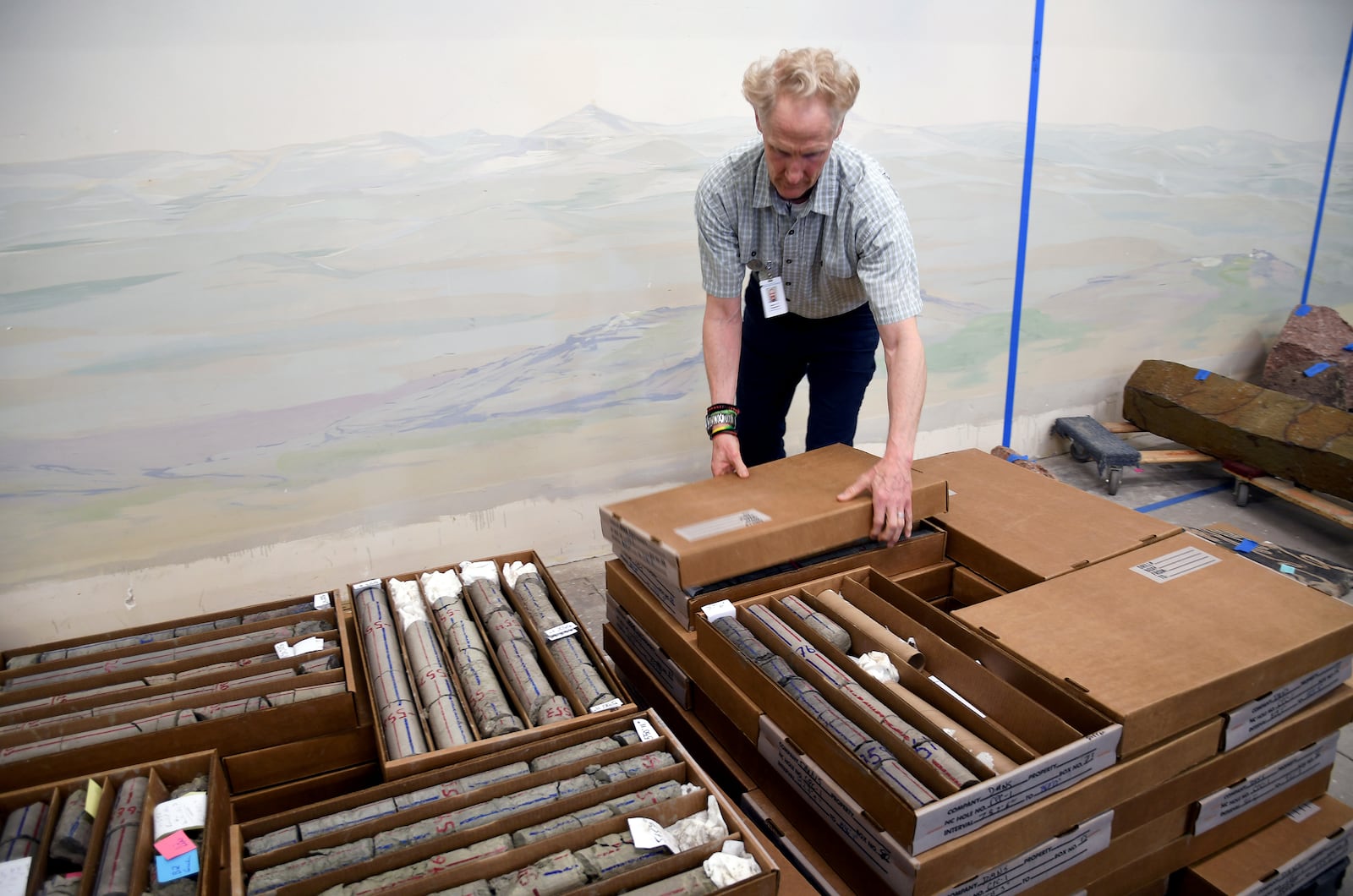 Geologist James Hagadorn closes boxes of core rock samples at the Denver Museum of Nature & Science on July 9, 2025. (AP Photo/Thomas Peipert)