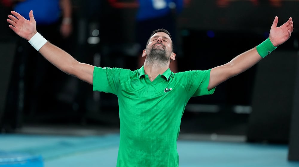 Novak Djokovic of Serbia celebrates after defeating Jannik Sinner of Italy in their semifinal match at the Australian Open tennis championship in Melbourne, Australia, early Saturday, Jan. 31, 2026. (AP Photo/Asanka Brendon Ratnayake)