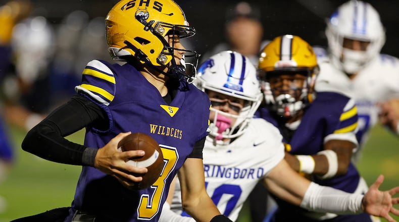 Springfield's Brent Upshaw during the quarterback keeper against Springboro. BILL LACKEY/STAFF