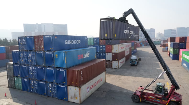 A crane unloads a container at the Uiwang ICD Terminal in Uiwang, South Korea, Thursday, March 12, 2026. (AP Photo/Ahn Young-joon)