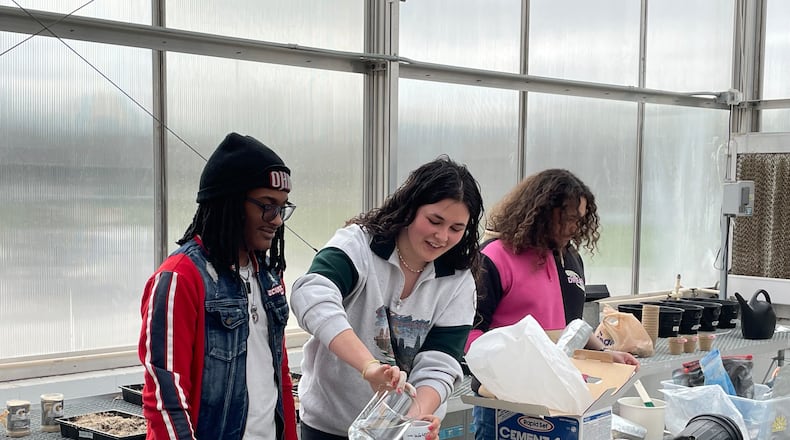 Grace Whitmore is pictured making stepping stones for the school’s garden. Contributed