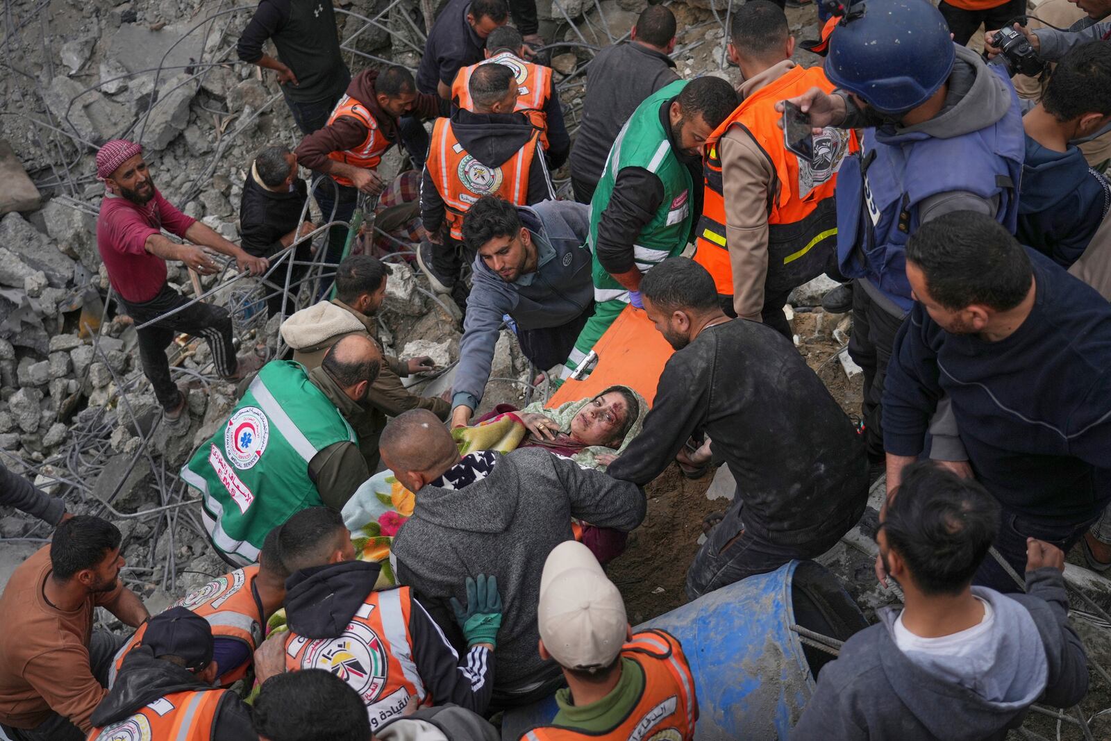 A pregnant woman is rescued from the rubble of the Manoun family's house after it was targeted by an Israeli army strike in Jabalia al-Balad, Gaza City, Sunday, April 13, 2025. (AP Photo/Jehad Alshrafi)