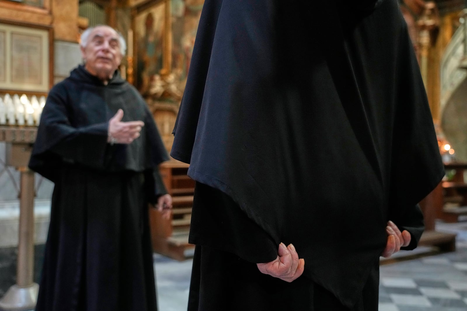 Augustinian friars Alberto Giovannetti, right, and Paolo Angelone speak during an interview in the Sanctuary of Our Mother of Good Counsel in Genazzano, Italy, Thursday, May 15, 2025. (AP Photo/Gregorio Borgia)
