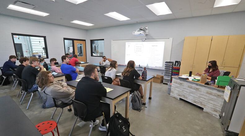 Greenon students returned to school Thursday with modified transportation routes. Here, students get used to their new school building earlier this month on the first day of class. BILL LACKEY/STAFF